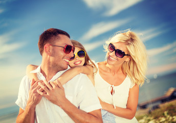 Poster - happy family in sunglasses having fun outdoors