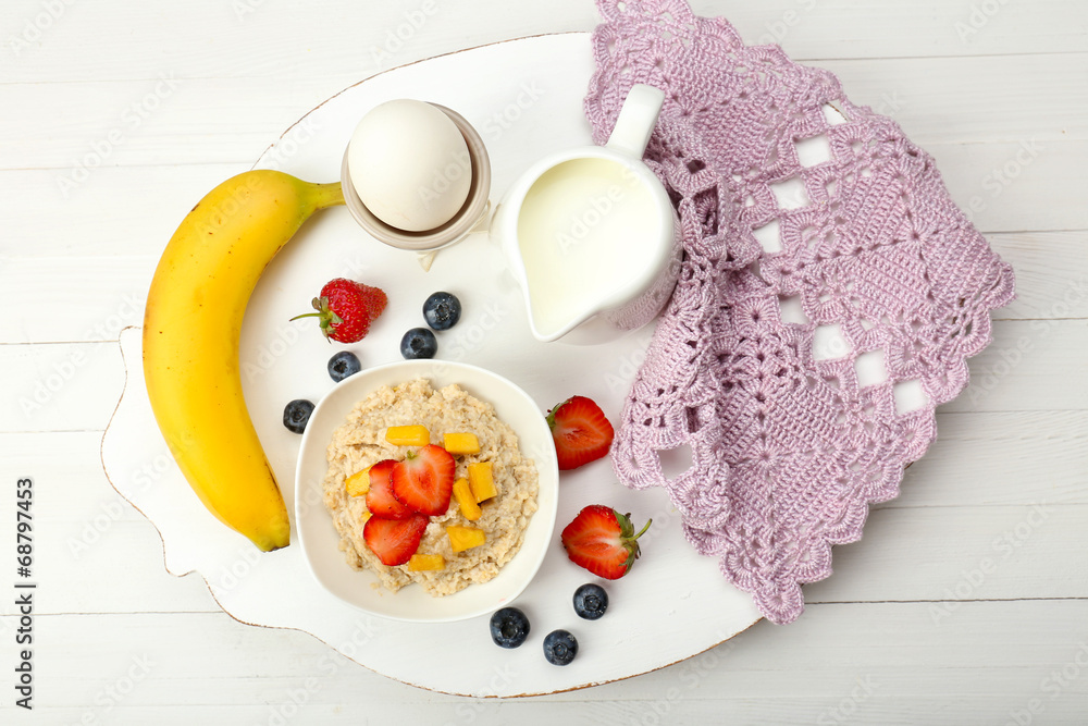 Delicious breakfast with oatmeal and milk
