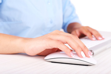 Canvas Print - Female hand holding computer mouse, close-up,