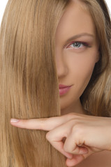  young woman keeps fingers straight hair