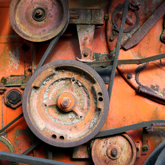 Wall Mural - rusty colorful detail of an old combine harvester