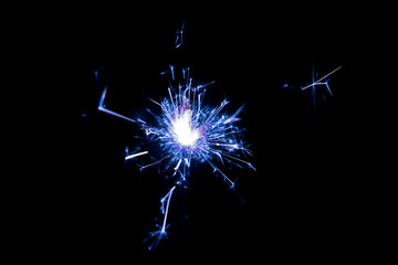 Wall Mural - Christmas sparkler on black background. Bengal fire