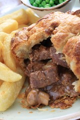 Sticker - steak and mushroom pie with chips and peas