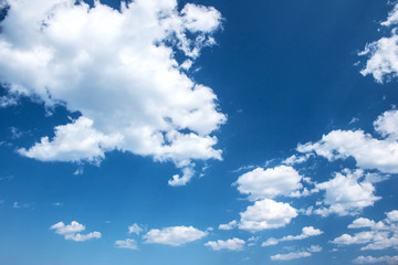 Wall Mural - Fluffy clouds on the blue sky