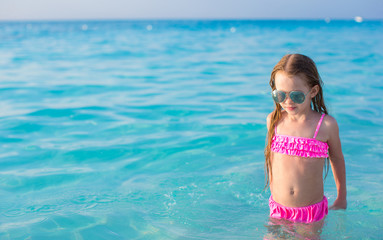 Sticker - Adorable little girl swim in turquoise water