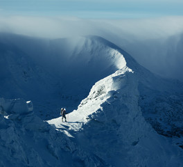 Sticker - Tourist in winter mountains