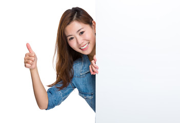 Wall Mural - Happy woman with blank placard and thumb up