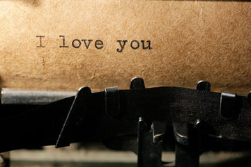 love is, the inscription on a typewriter