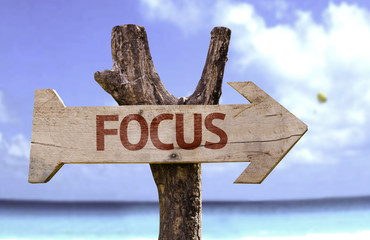 Focus sign with a beach on background