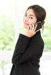 © siraphol - Business woman talking cellphone