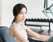 © siraphol - Woman workout at fitness