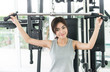 © siraphol - Woman workout at fitness