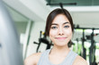 © siraphol - Woman workout at fitness