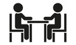 Zwei Menschen sitzen am Tisch