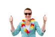 © Wisiel - woman with garland on neck with thumbs up smiling