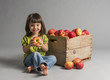 Child with crate of apples