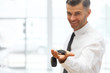 © puhhha - Car Salesman Giving Key of New Car at Showroom