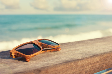 wooden sunglasses and the sea