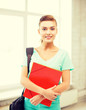 © Syda Productions - student girl with school bag and color folders