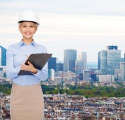 Sticker - smiling businesswoman in helmet with clipboard