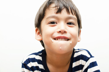 Little boy eating rice happy face