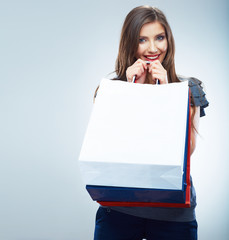 Wall Mural -  Portrait of happy smiling woman hold shopping bag. Female mode