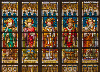 bruges - saint bishops on the windwopane in st. jacobs church