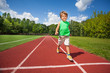 © Sergey Novikov - Cute small boy runs slowly on the marathon road