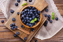Wooden Bowl Of Blueberries