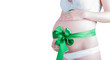 Beautiful young pregnant woman with green ribbon. Isolated on wh