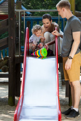 Wall Mural - Happy family on the playground