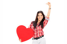 Attractive Woman Holding A Big Red Heart