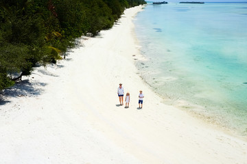 Wall Mural - Mother and kids at tropical beach