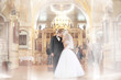 bride and groom get married in church