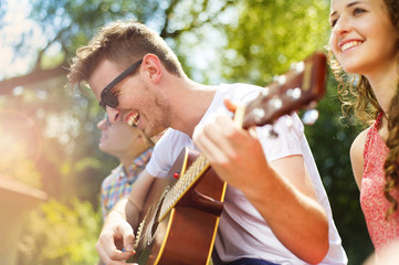 Friends having fun with guitar