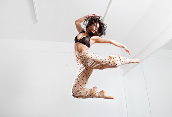 Jumping young woman on a trampoline