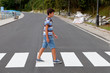 © Gelpi - Teenager through a zebra crossing