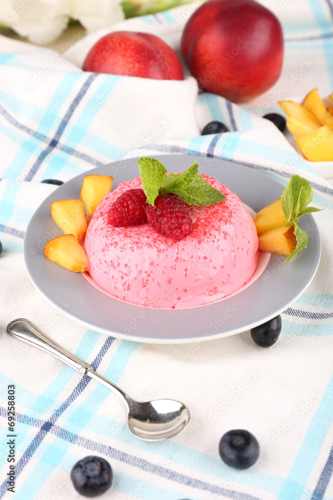 Heart shaped cake with fruits and berries on plate on