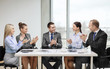 © Syda Productions - business team with laptop clapping hands
