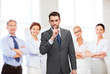 © Syda Productions - group of smiling businessmen making hush sign