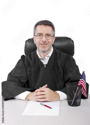 Fotografija middle aged caucasian american judge in a robe sitting