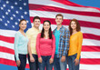© Syda Productions - group of smiling teenagers over american flag