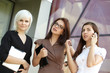 © photoniko - a group of businesswomеn from tablets on the street
