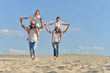 © aletia2011 - Boys with grandparents sitting on sand