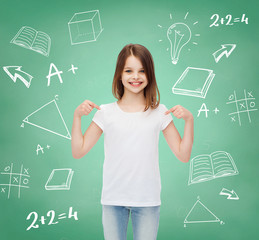 Wall Mural - smiling little girl in white blank t-shirt