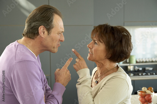 Fotografie, Tablou Mature couple pointing to each other