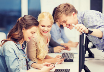 Canvas Print - students with computer monitor and smartphones