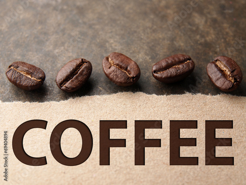 Naklejka - mata magnetyczna na lodówkę Coffee crop beans with paper on wood texture background