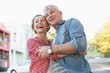 © WavebreakmediaMicro - Happy mature couple hugging in the city