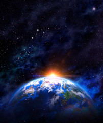 Wall Mural - sunrise over earth in outer space